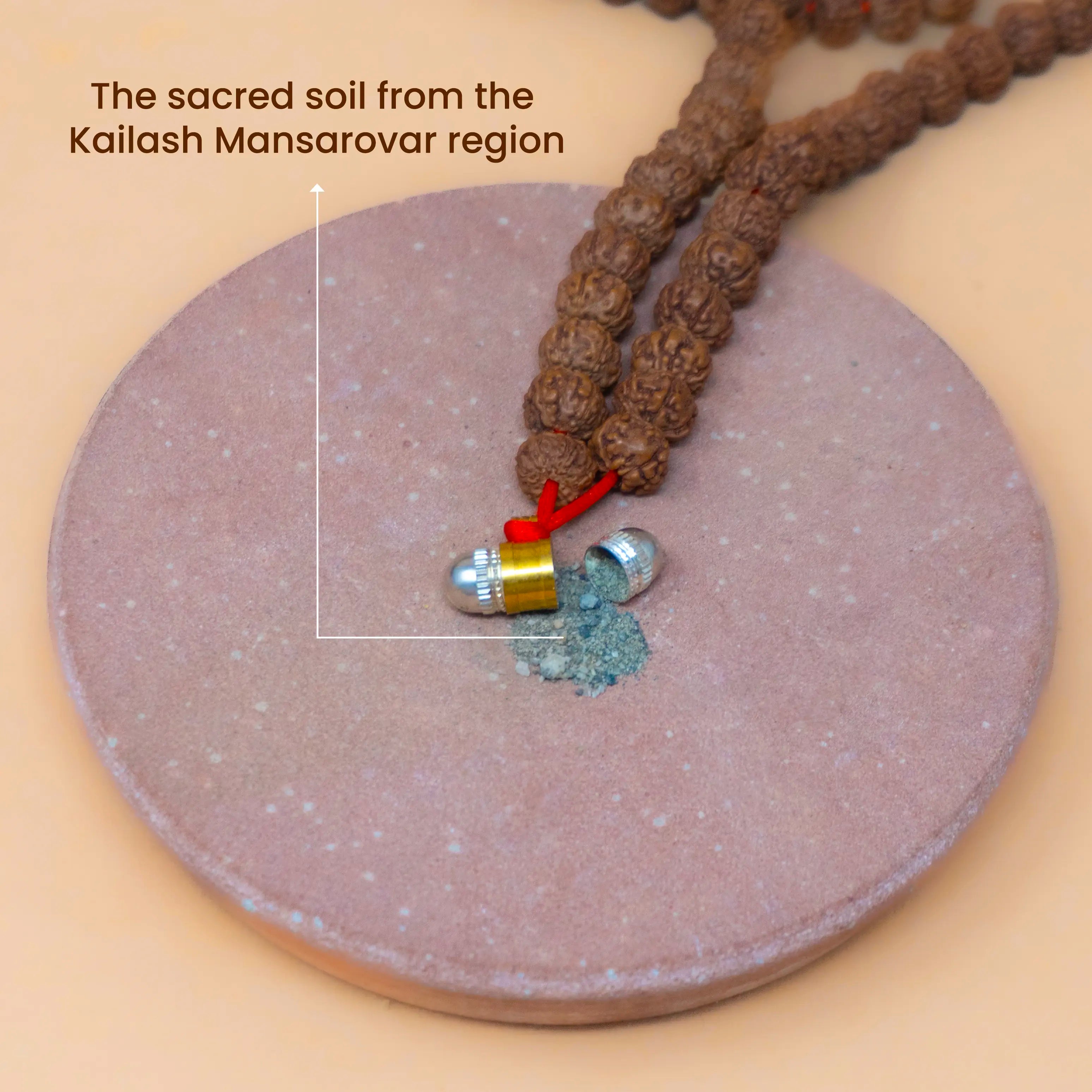 Sacred Soil from Kailash Mansarovar region inside the locket